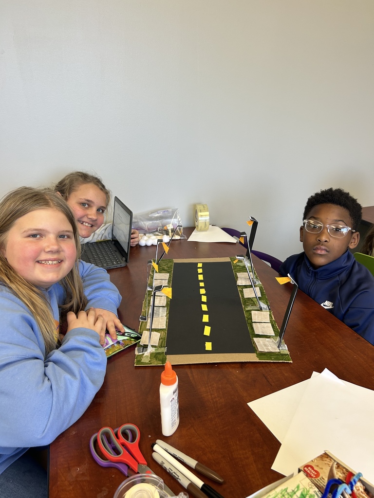 fifth graders with their project