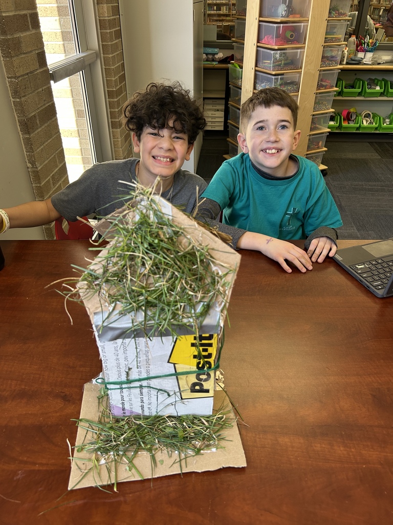 fifth graders with their project