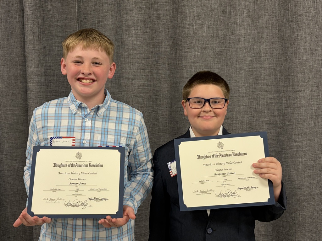 Roman and Benjamin pictured with awards