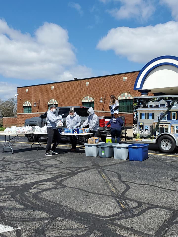 RhinoShield employees and family members prepare to give away 100 meals RhinoShield employees and family members prepare to give away 100 meals