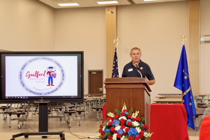 School Board President Scott Flood speaks to guests during the Guilford Elementary School ribbon-cutting ceremony School Board President Scott Flood speaks to guests during the Guilford Elementary School ribbon-cutting ceremony