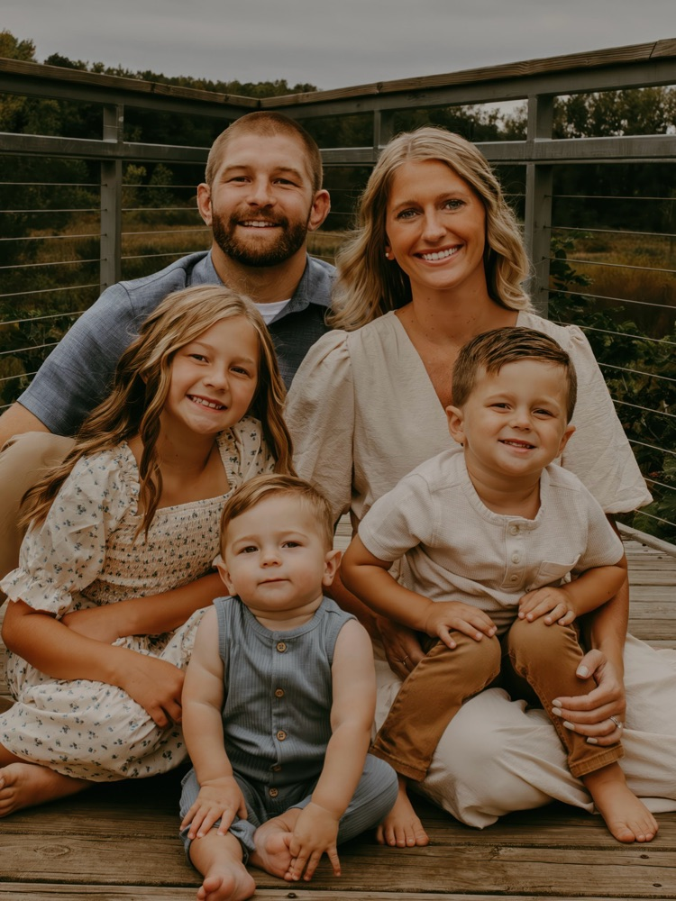 picture of new varsity wrestling coach with his family