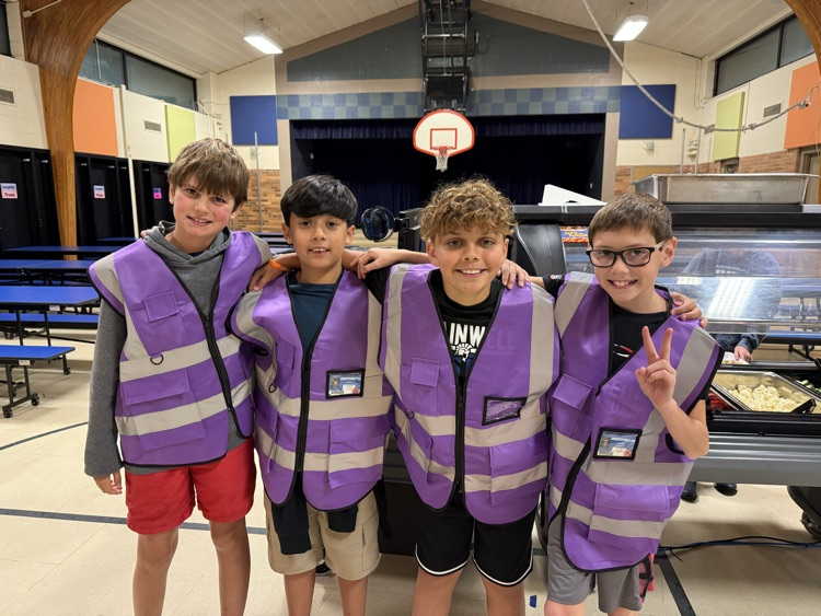 picture of four cooper elementary safeties helping in the lunchroom 