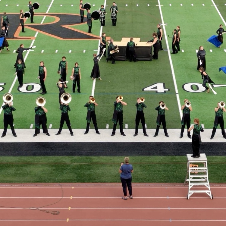 picture of Trojan marching band performing in a competition 