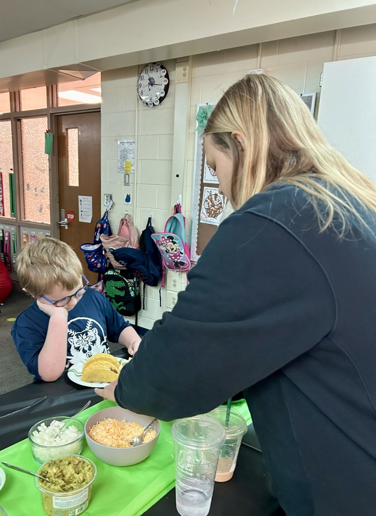 picture of student and teacher making tacos