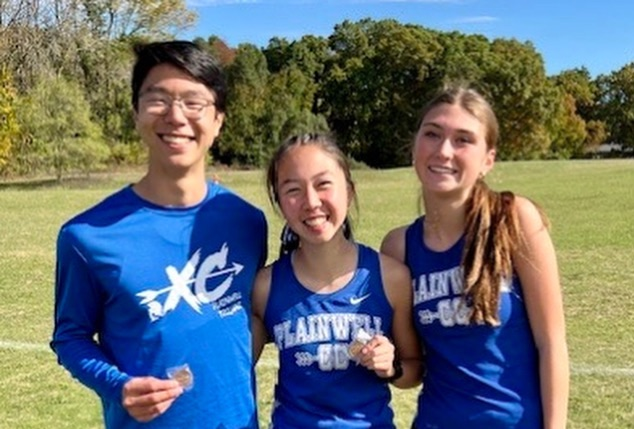 picture of three cross country runners