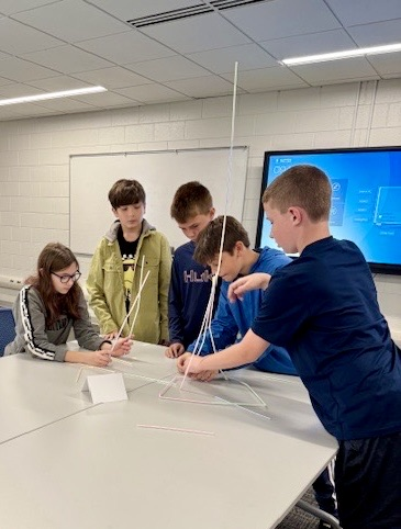 picture of students working together to build a tower