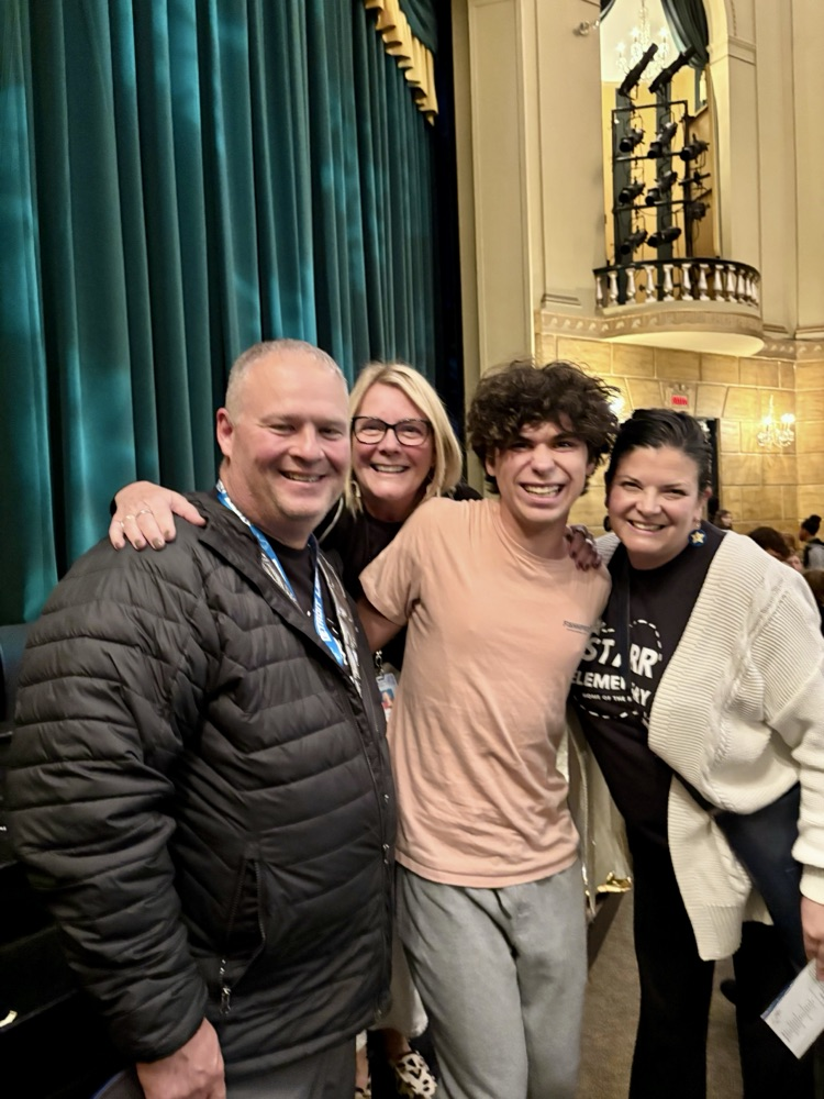 picture of student with three Starr teachers 