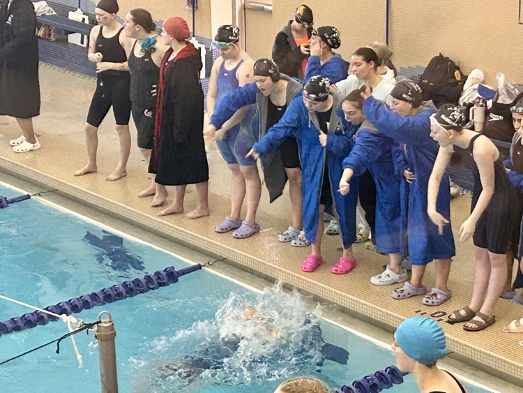 picture of swim team at their championship meet 