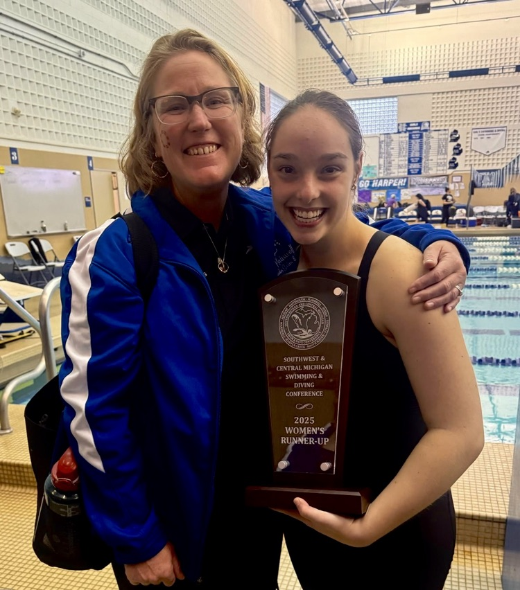 picture of phs diver with diving coach holding a trophy