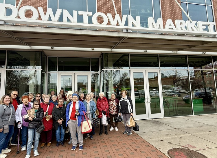 group picture of lifelong learners on a trip to the downtown market in Grand Rapids 
