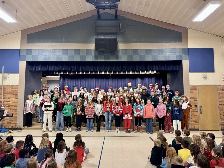 picture of phs & pms choir performing for elementary students