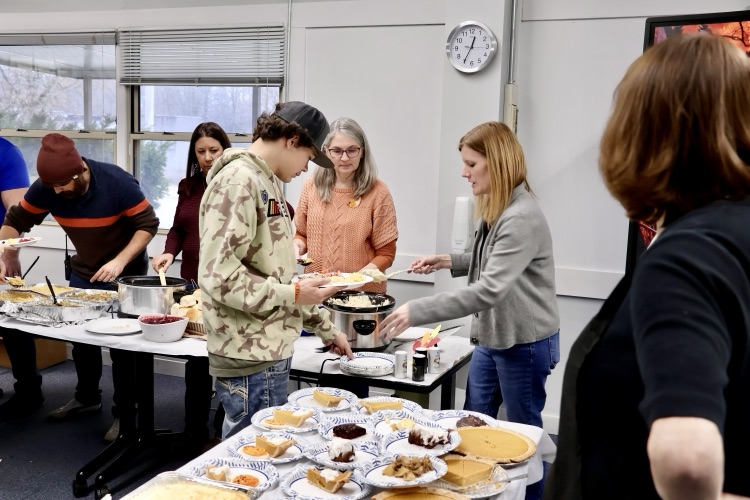 picture of student and teachers at RHS during their annual Thanksgiving feast