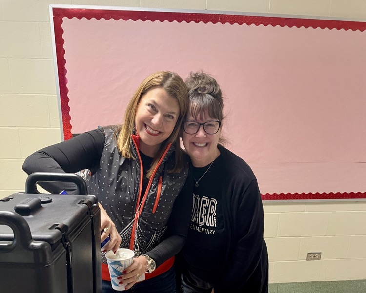 picture of cooper principal with a coffee and cookie cart for her staff 