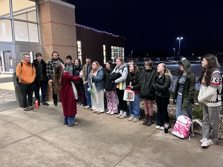 picture of group of phs choir students singing  carols 