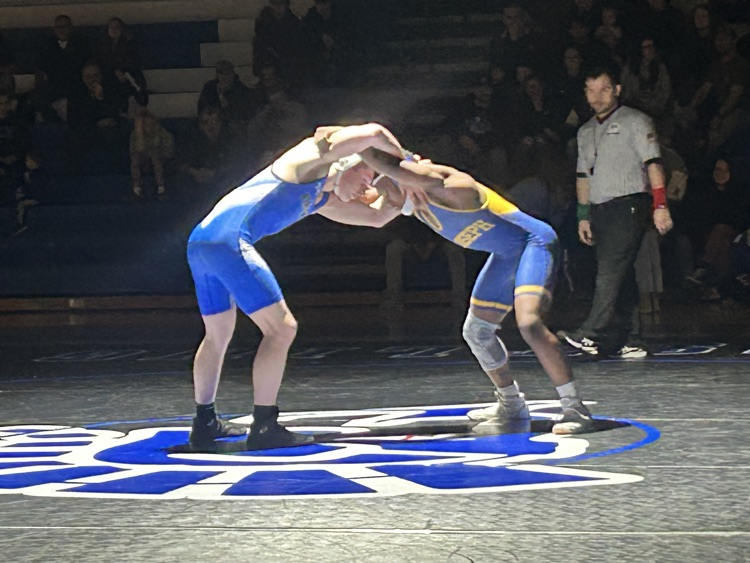 picture of two boys wrestlers in Friday night lights competition 