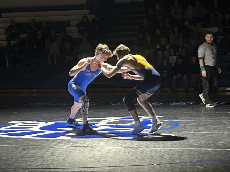 picture of two boys wrestlers in Friday night lights competition 