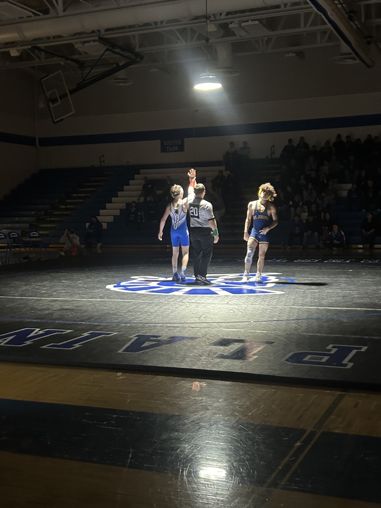 picture of two boys wrestlers in Friday night lights competition 