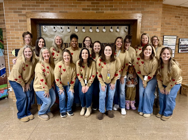 picture of cooper staff wearing matching sweaters