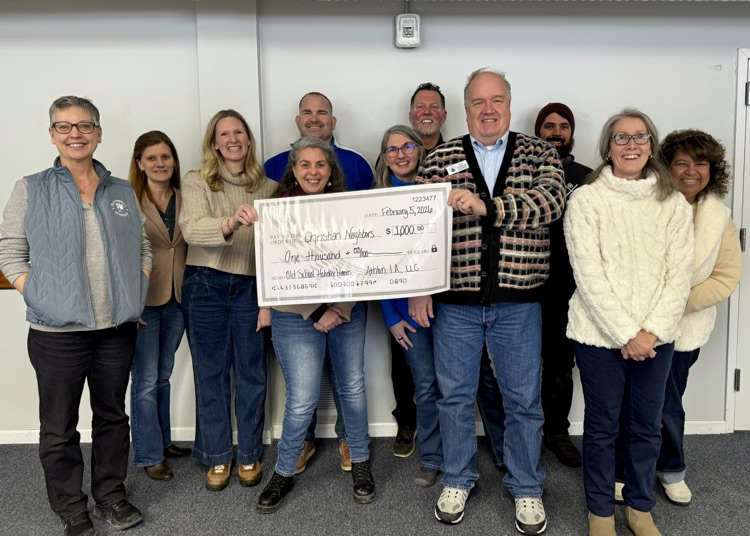 picture of RHS presenting a check to Christian neighbors staff