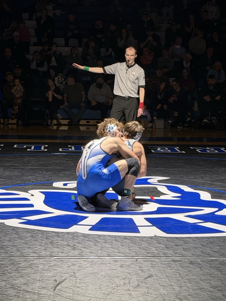 picture of phs wrestler in district championship match