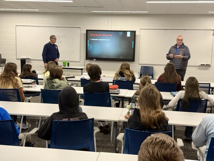 picture of two presenters presenting at the middle school