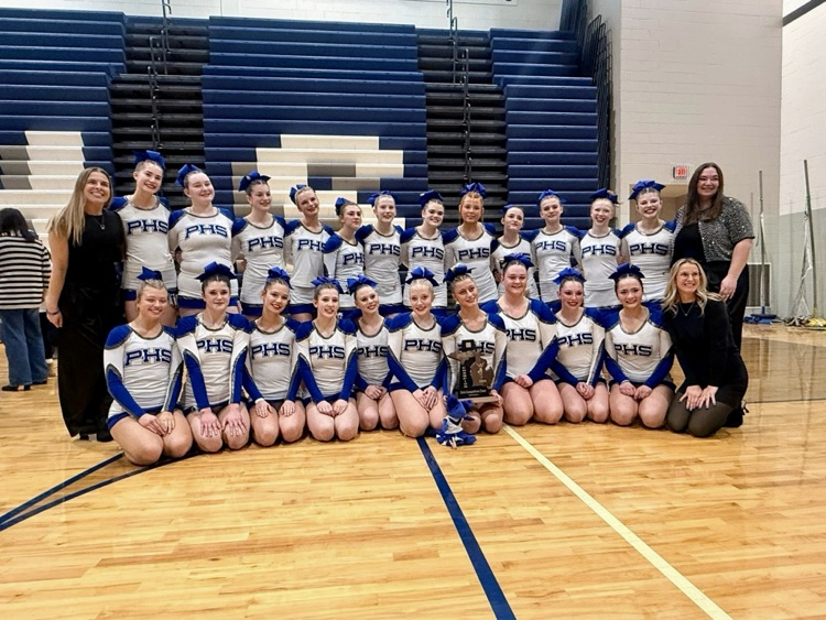 Varsity cheer team with District Championship trophy