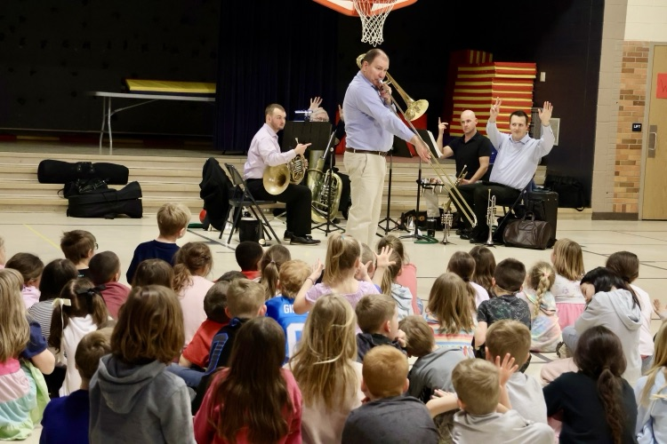 picture of the Kalamazoo symphony orchestra performing for cooper students 