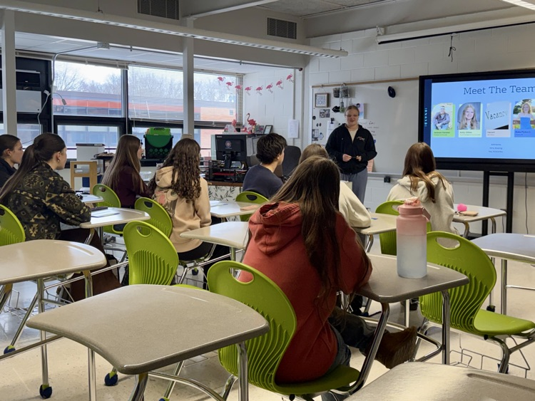 picture of student group meeting in a classroom at PHS 