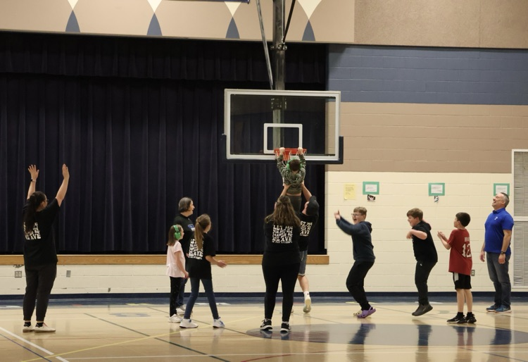 picture of student and staff at their unified champions basketball game 
