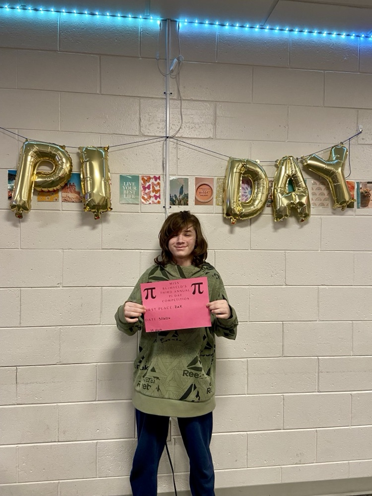 student with certificate for winning pi day contest