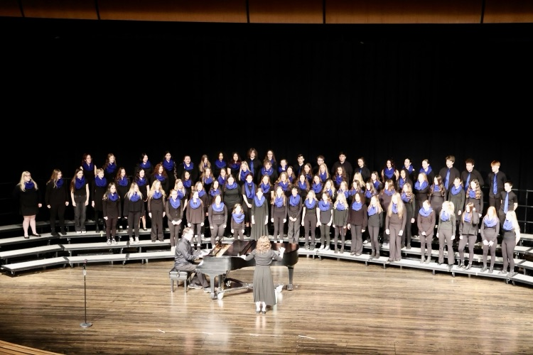 middle school choirs performing at their formal concert