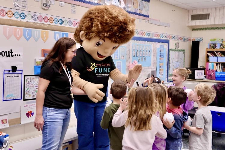 my future fund mascot giving high five to kindergartners