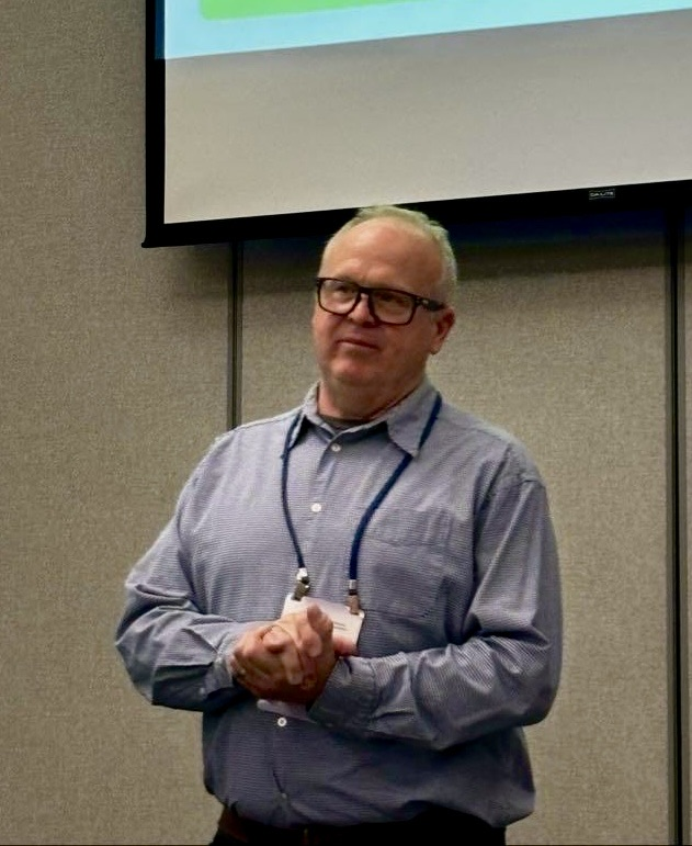 picture of renaissance high school educator, Mr. MacQueen, presenting at a conference 
