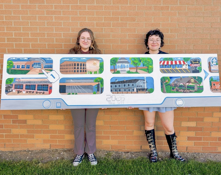 picture of two senior artists with their class of 2026 senior mural painting