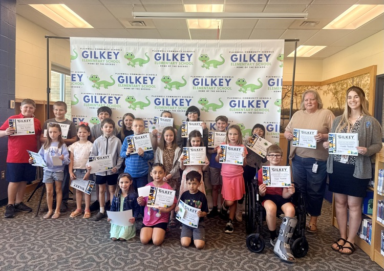 group picture of Gilkey students and staff of the month holding their certificates