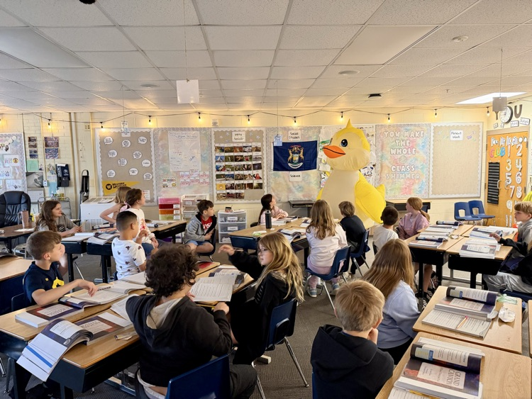picture of classroom of students with principal Luckett visiting dressed as a duck for students reaching fundraising goal