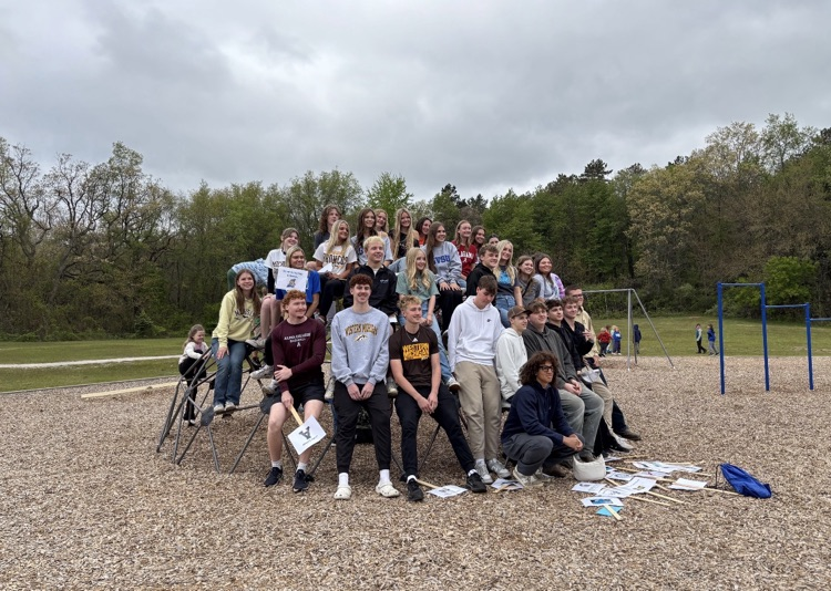 picture of senior students on a play structure at their elementary playground
