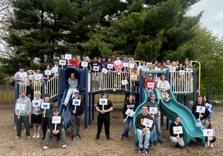 picture of senior students on a play structure at their elementary playground