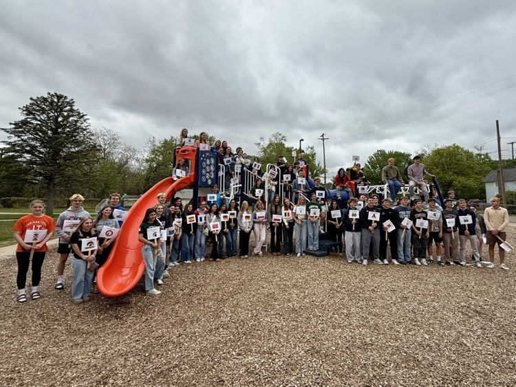 picture of senior students on a play structure at their elementary playground