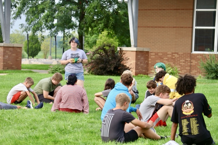picture of group of students doing an outdoor team building activity during the phs champions program