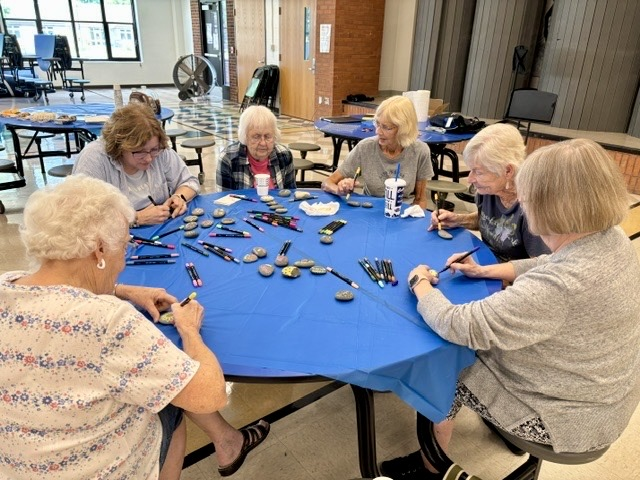 picture of lifelong learner group painting rocks