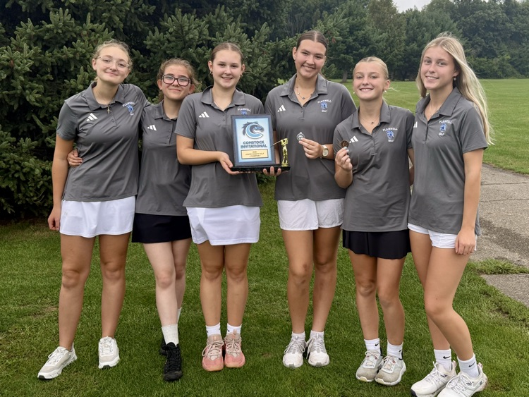 picture of 6 jv gold teammates holding a trophy