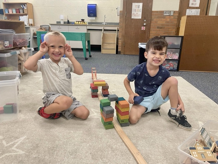 picture of two preschool students playing with blocks