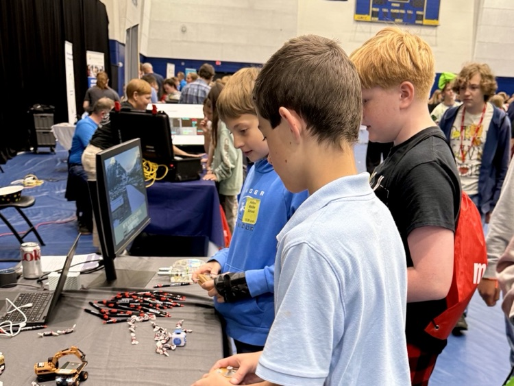 picture of three middle school students at an it field trip