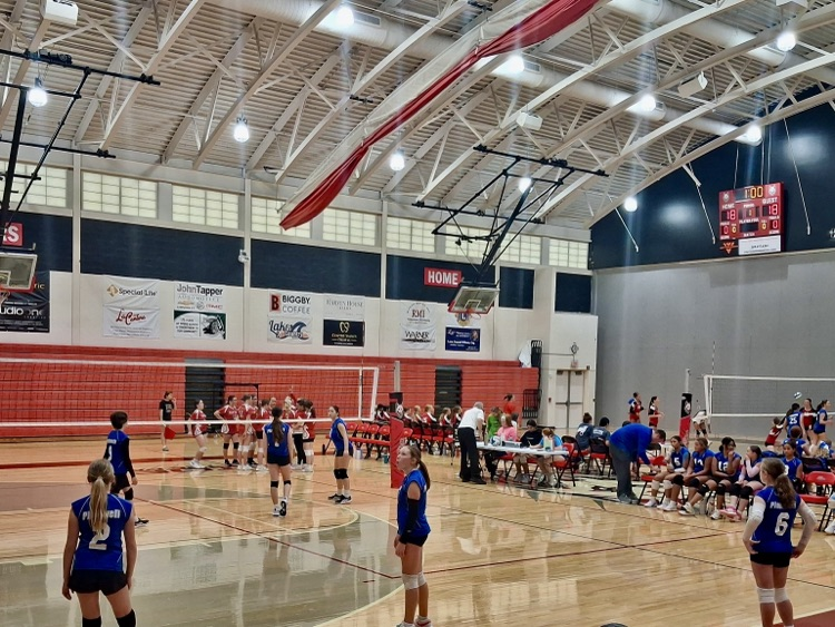 picture of 7th grade volleyball team during a game