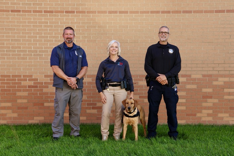 picture of PCS safety team, Mr. Kaechele, Ms. Freeman with safety dog Ginny and Mr. Farris