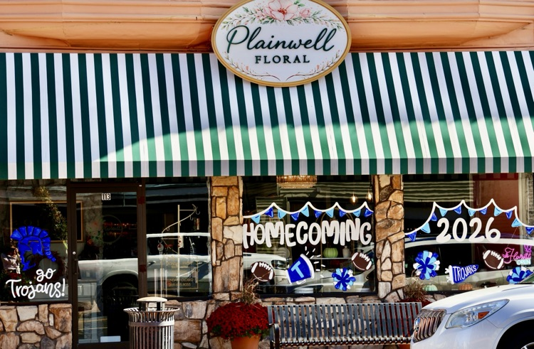 picture of downtown business with windows painted for homecoming week