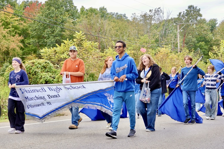 picture of phs marching band marching in the homecoming parade