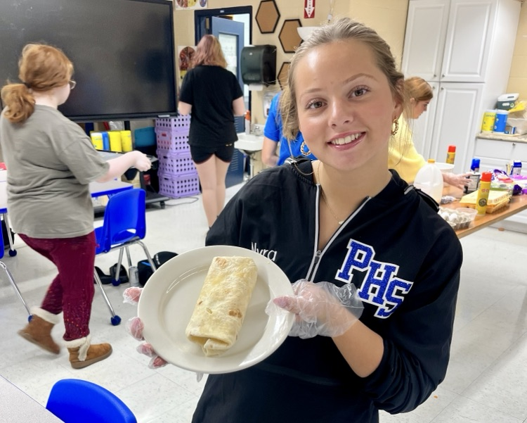 picture of student in food and nutrition course making a burrito